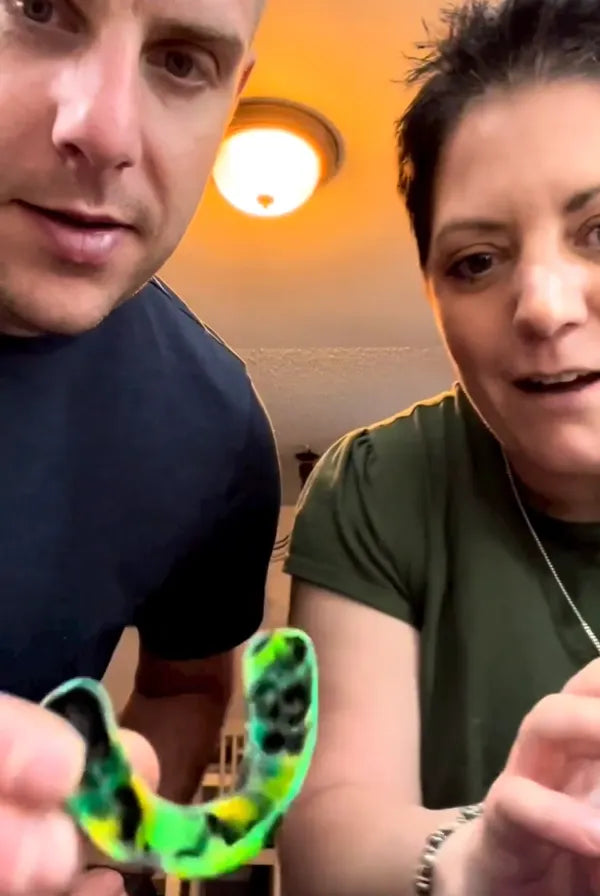 couple showing camo custom mouth guard