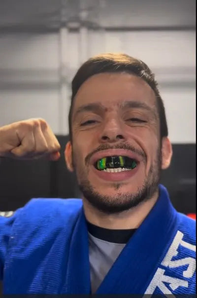 MMA athlete with a custom sports mouth guard preparing for a fight