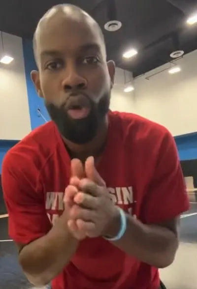 Basketball player wearing a custom sports mouthguard during a dunk attempt