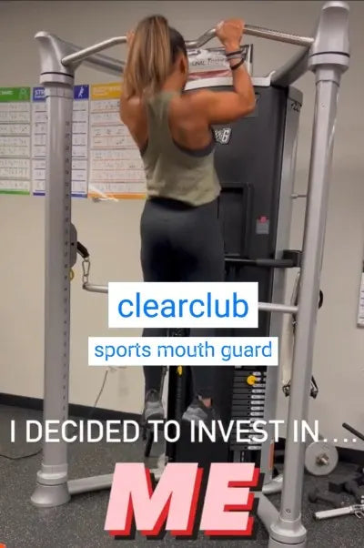 Weightlifter wearing a custom sports mouthguard while lifting a heavy barbell