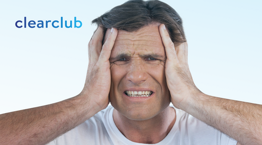 Man suffering from teeth grinding headaches