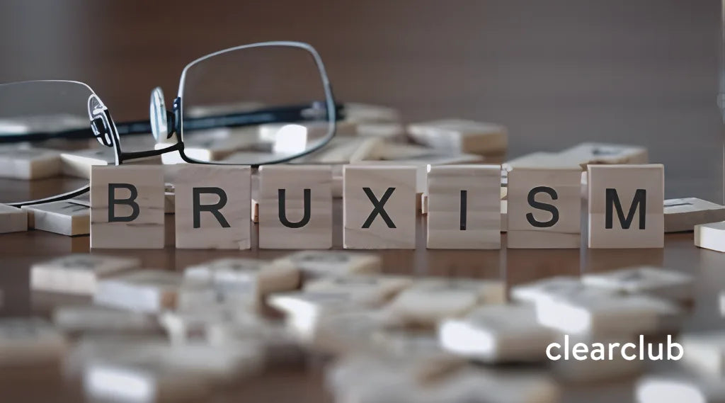 Wooden letter tiles spelling "Bruxism" on a light surface.