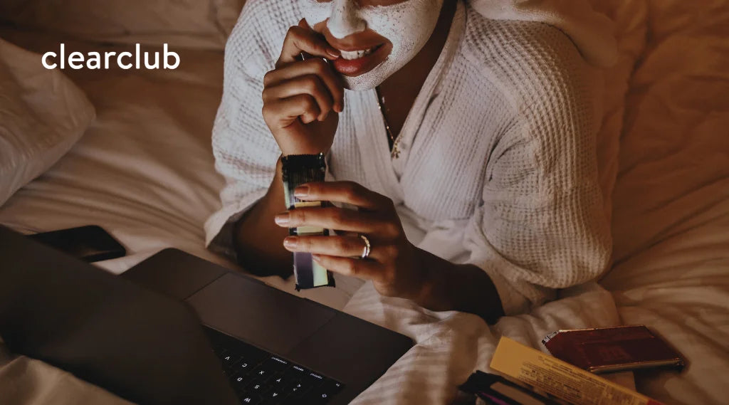 Woman snacking on chocolate bars late at night 
