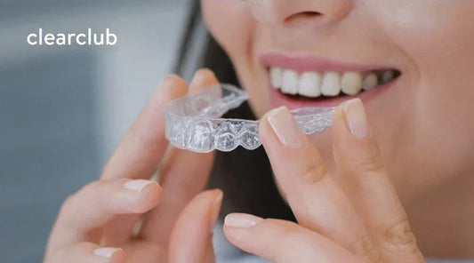 Woman putting in her custom dental guard