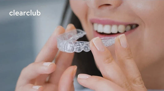 Woman putting in her custom dental guard