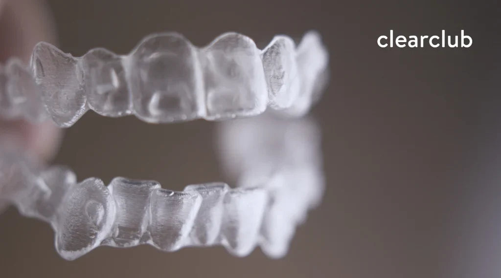 Two clear custom night guards for upper and lower teeth, illustrating the difference between upper and lower night guards.