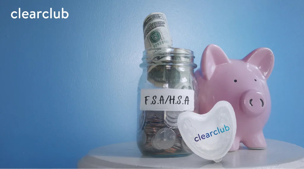 Jar labeled ‘FSA/HSA’ filled with coins and bills, next to a piggy bank and ClearClub night guard case, showing FSA/HSA savings for dental care.