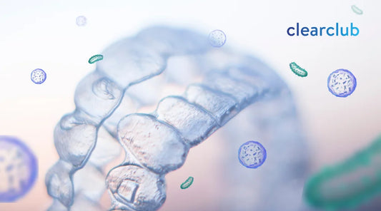 A transparent retainer covered in bacteria, showing how unclean retainers can harbor harmful microbes.