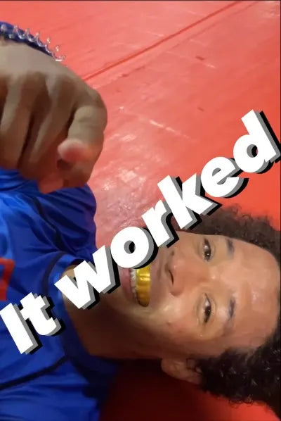 Wrestler wearing a custom sports mouth guard during a match