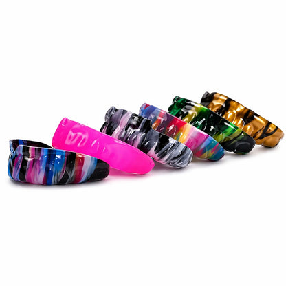 Custom multicolor sports mouth guards in assorted designs on white background